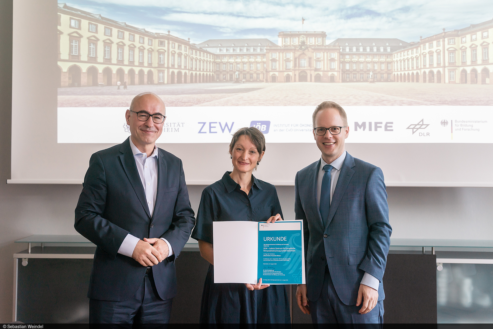 Group picture with Professor Achim Wambach, Professor Tabea Bucher-Koenen and Jens Brandenburg