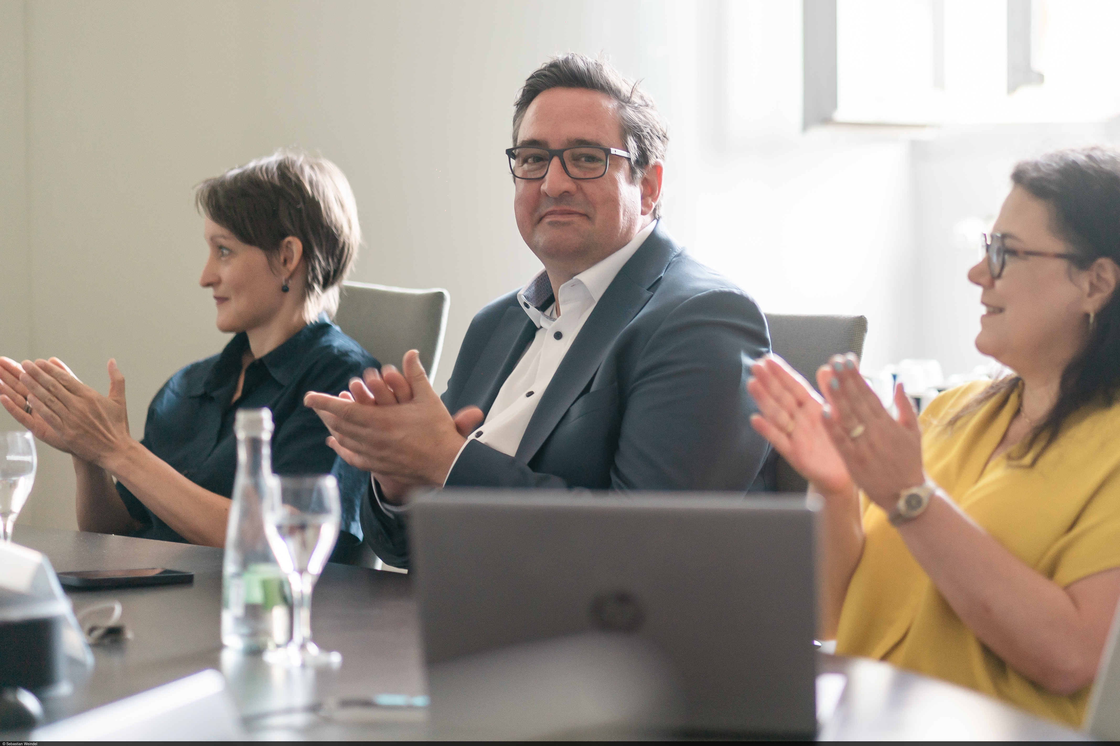Professor Dirk Loerwald sits at the meeting table.