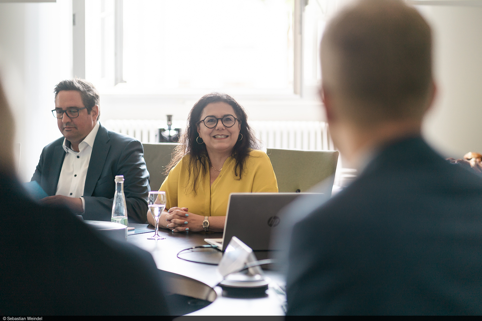 Professor Carmela Aprea sits at the meeting table.