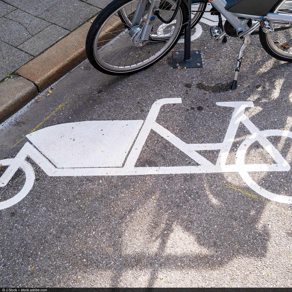Picture of a cargo bike car park with appropriate markings on the ground